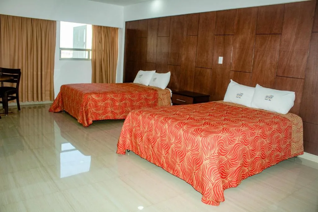 Spacious guest room at Hotel RRU Puebla